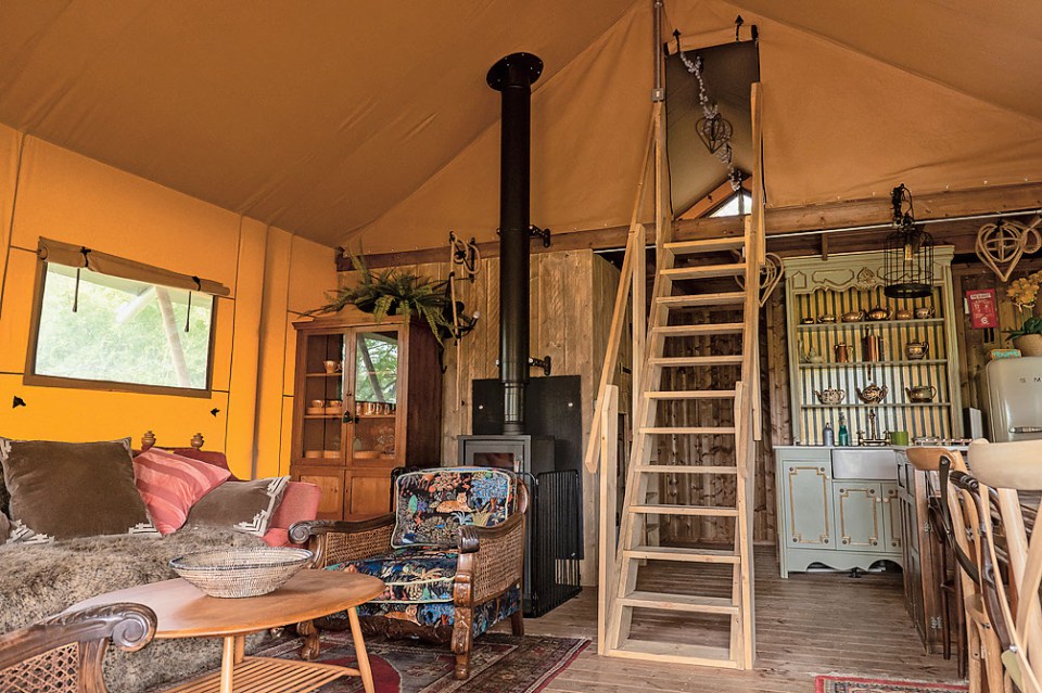 Relax in a jungle-inspired safari tent on this traditional campsite