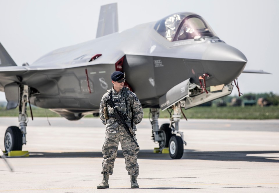 US security guard an F-35 jet, described as the world’s most advanced combat plane