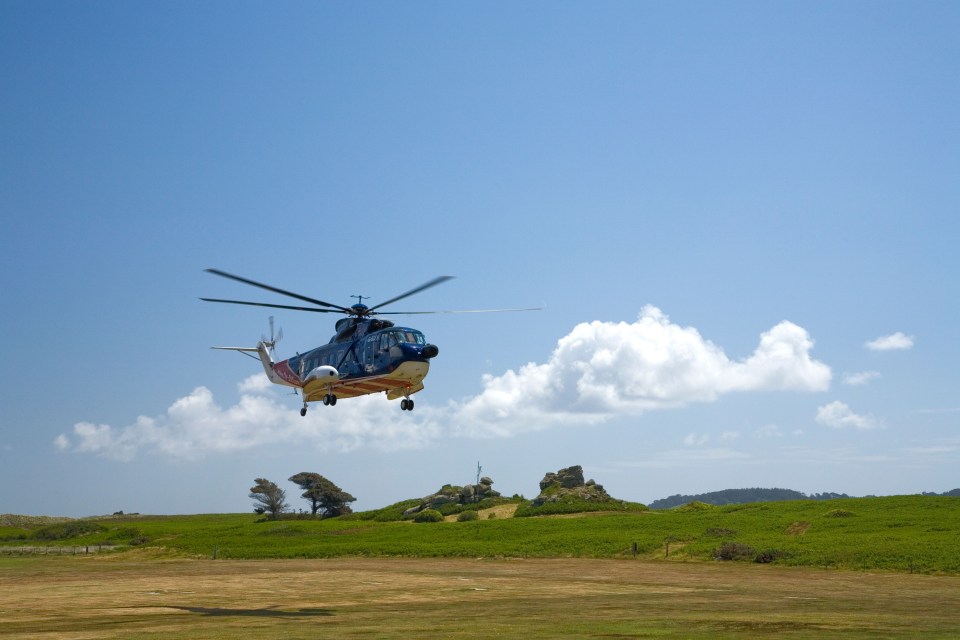 A helicopter taking off from Tresco Island - the only way to get there is by air as cars are banned