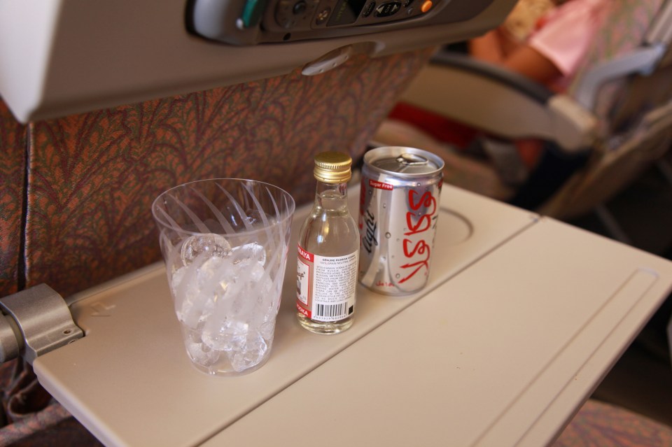 Some airlines will let you do it openly, if the cabin crew pour the drinks for you