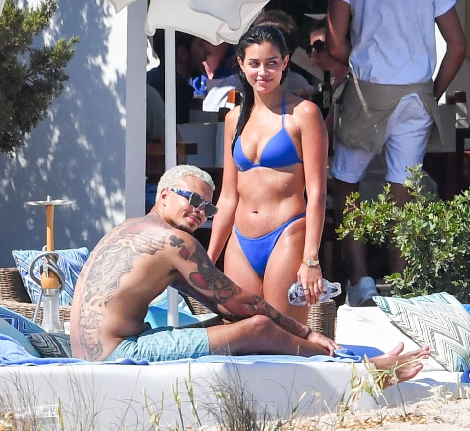 Dele Alli looked loved up with his girlfriend Cindy Kimberly as they sunbathed in Italy