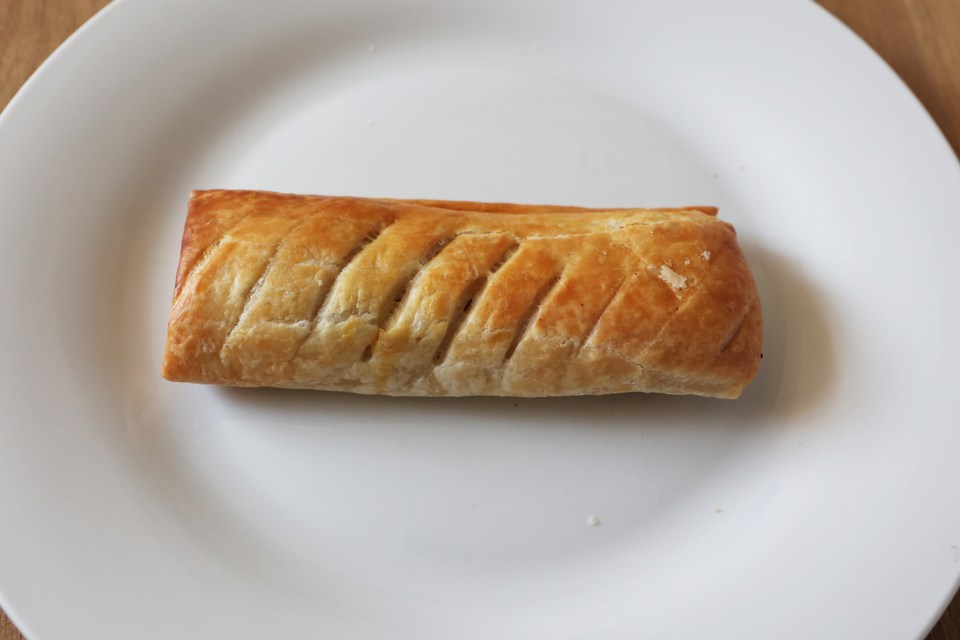 a white plate with a pastry on it