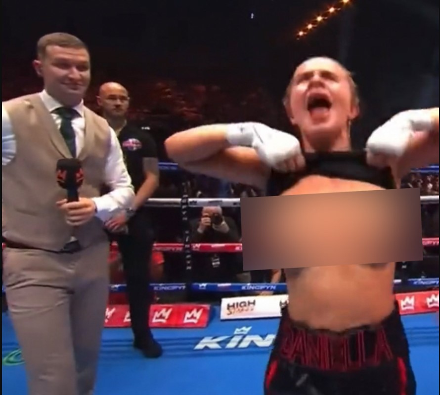 a woman in a boxing ring with the word angela on her shorts