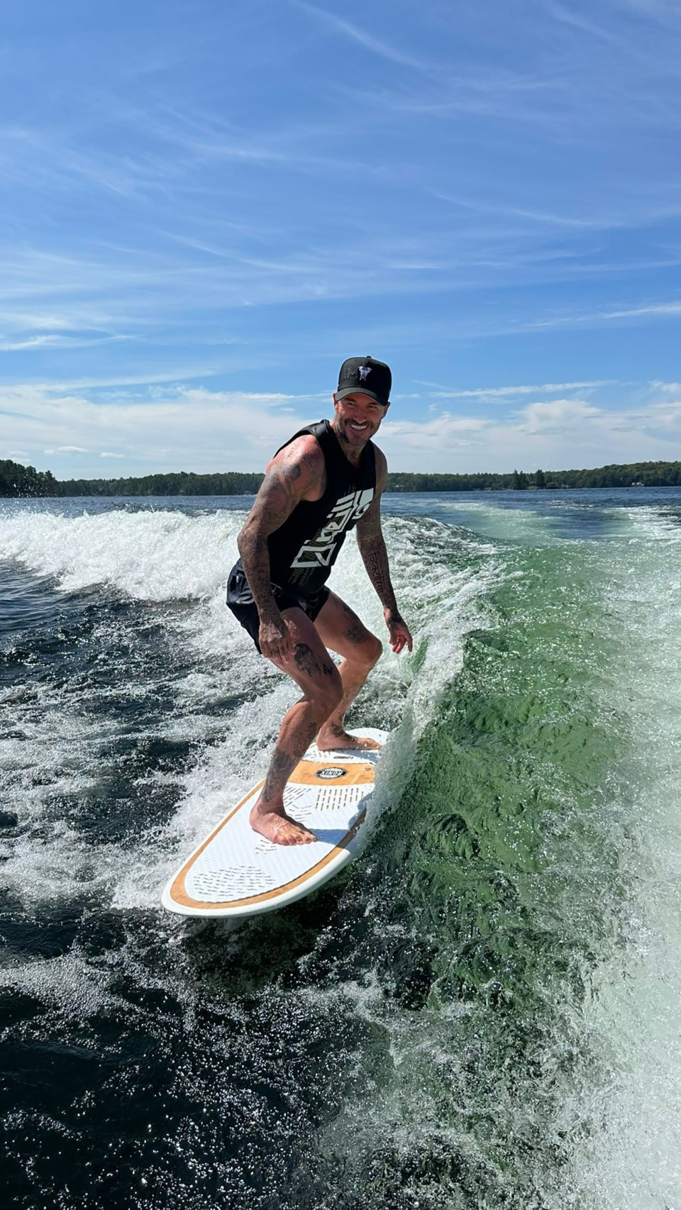 David showed he still has perfect balance by having a try at surfing