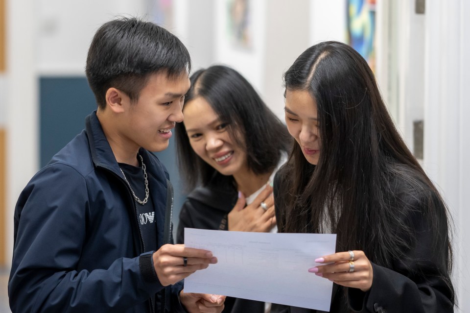 Raymond Xie opens his GCSE results at Ffynone House School Swansea, Wales