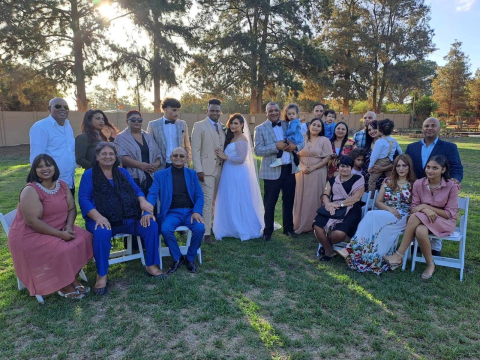 A bride decided to be walked down the aisle by her 'two dads' on her wedding day