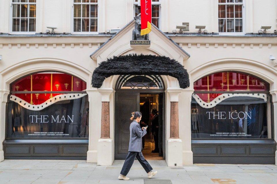 A giant moustache has been hung over the doorway to the gallery