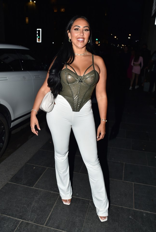 Sophie wowed in a khaki coloured see through corset top on a boozy night out recently