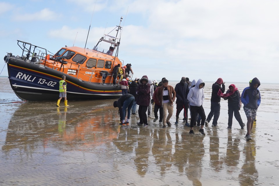 A group of people thought to be migrants are brought in to Dungeness, Kent, by RNLI lifeboat following a small boat incident in the Channel