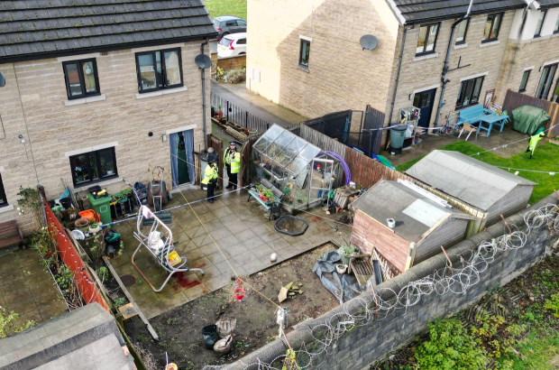 The teenager was found injured in a back garden in Halifax, West Yorkshire