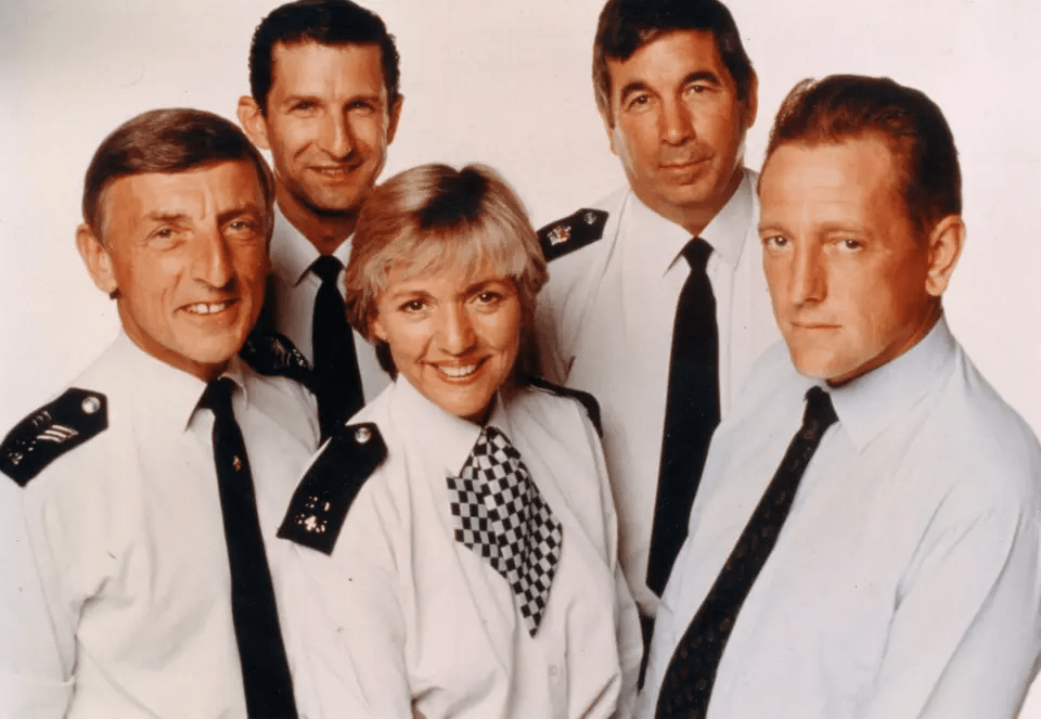 a group of police officers are posing for a photo