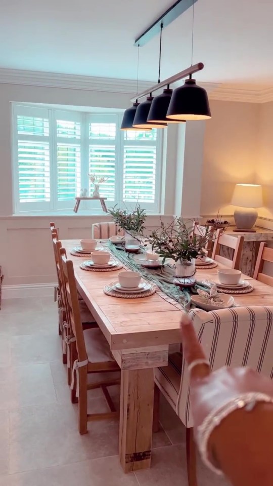 While the dining room includes a table made by her dad, and is laid with items from her homeware range