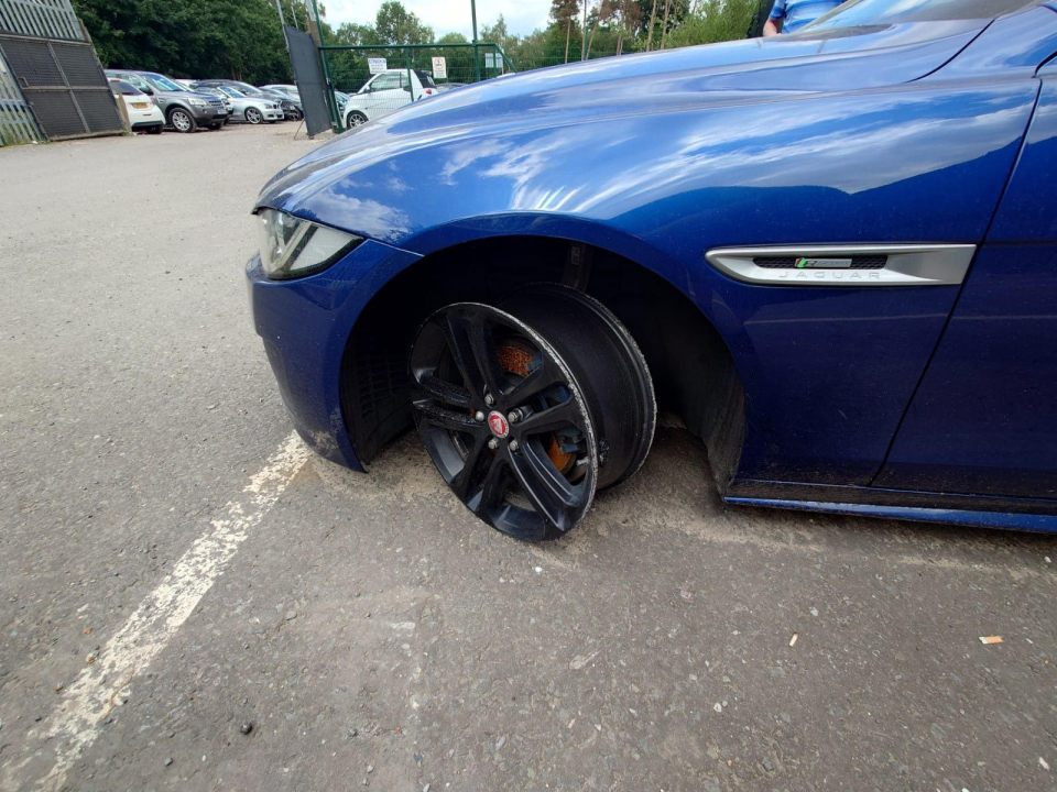 The Jaguar XE is now resting outside her parents' home ahead of costly repairs