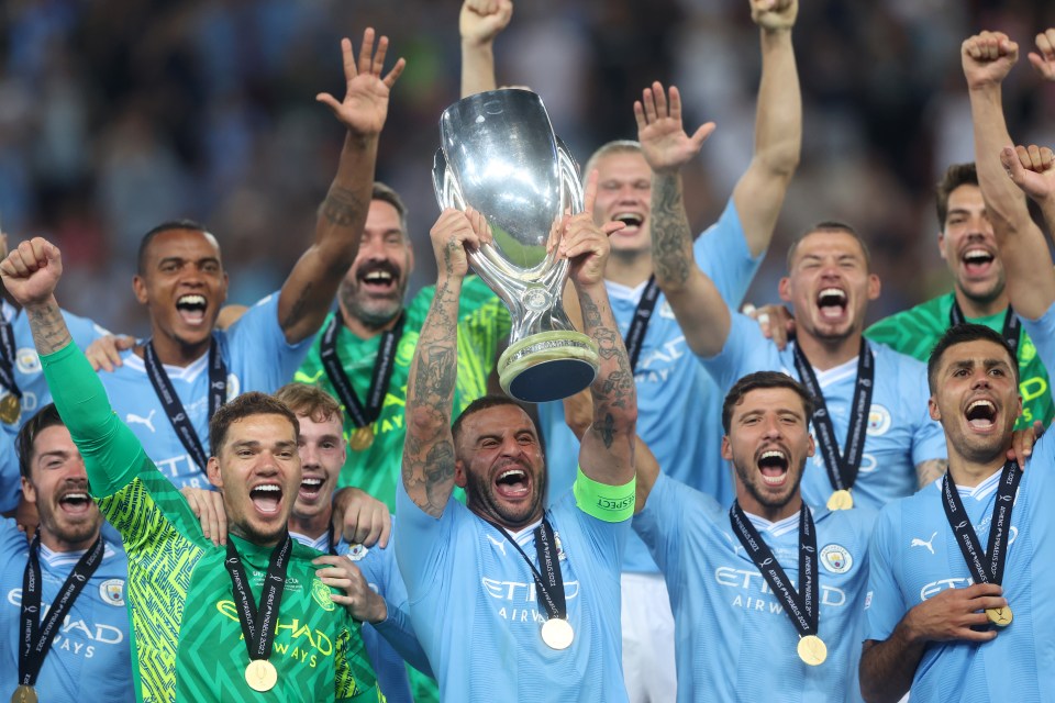 Kyle Walker lifts the trophy is City get their first silverware of the season