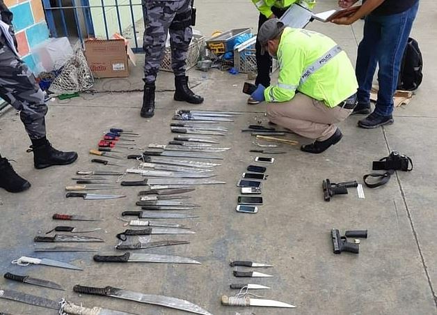 Guns and knives seized from a prison in Ecuador that houses gang members