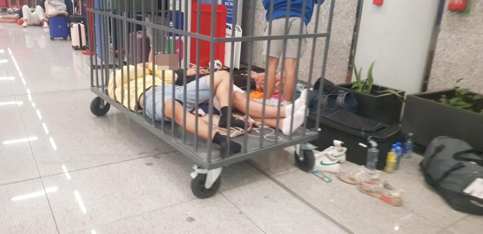 Grim scenes at Palma Airport in Mallorca on Tuesday saw kids sleeping in baggage trolleys