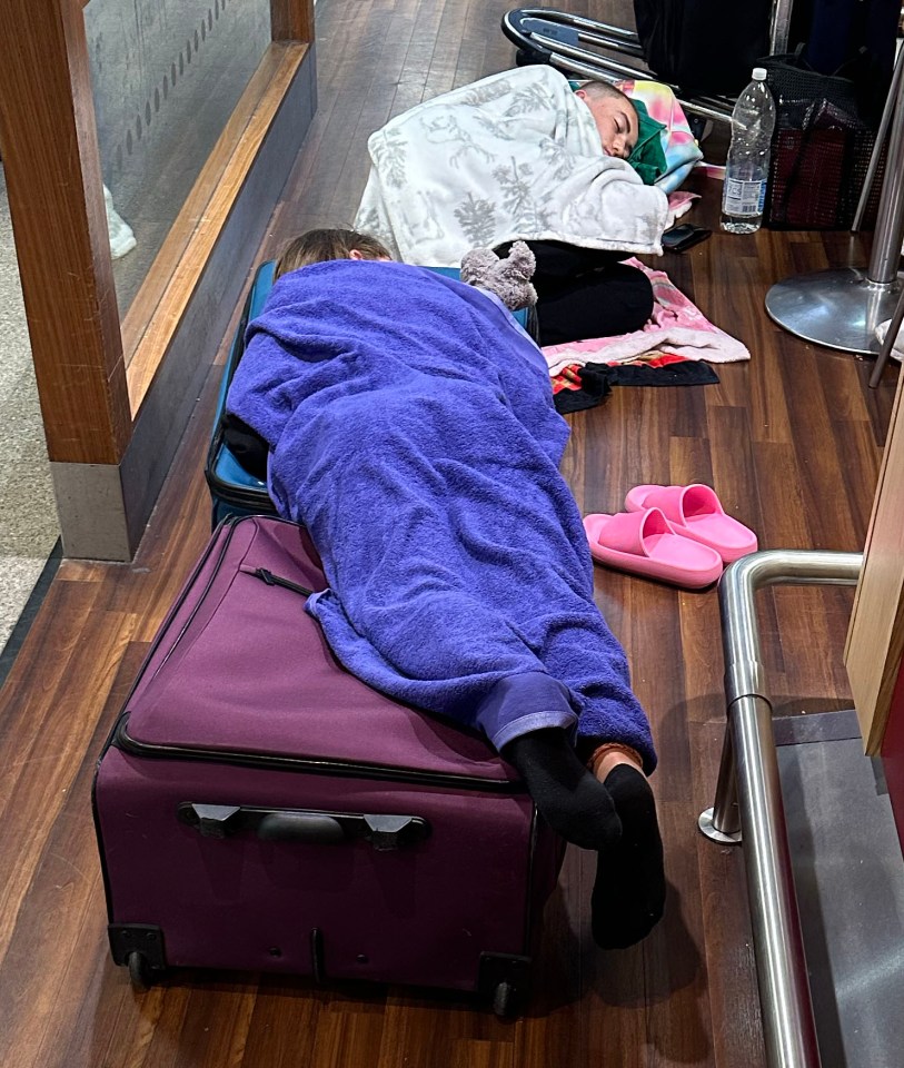 Manchester airport early Tuesday morning as stuck travellers try to get some sleep