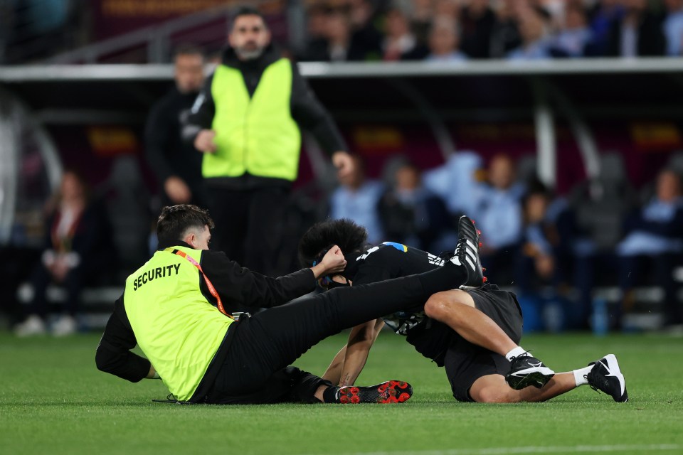 The protester was rugby tackled to the ground