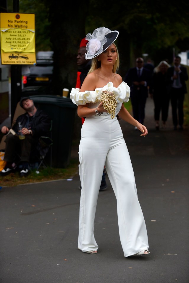 One woman opted for a white jumpsuit with a ruffle neckline, and eye-catching monochrome hat