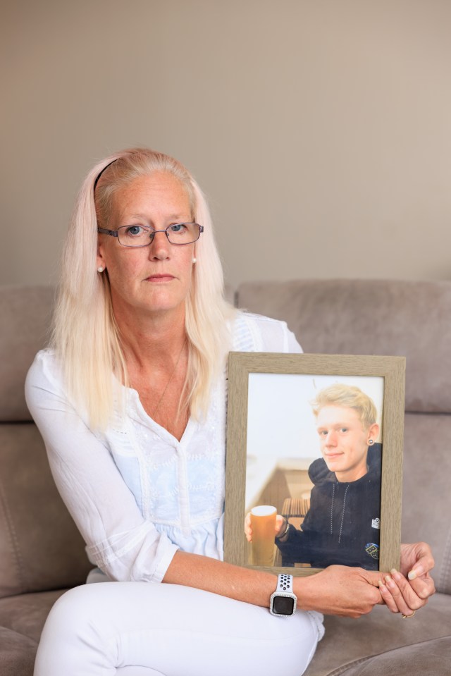 Michelle with a photo of her son Robert, who died of a fentanyl overdose in 2016