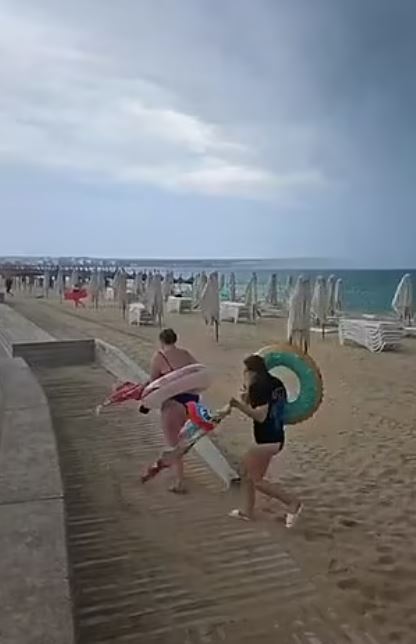 Beachgoers were forced to flee as deck chairs and parasols were blown away