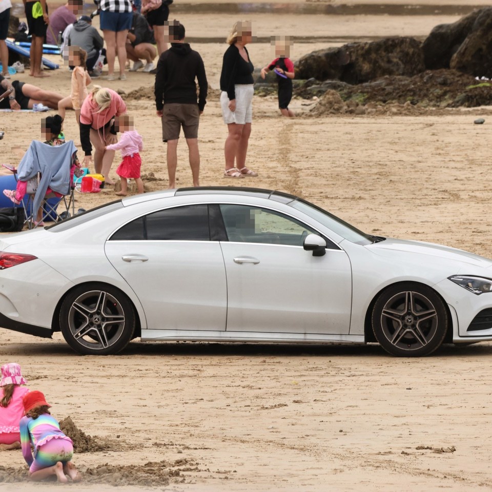 A Mercedes was spotted driving around a Cornish beach