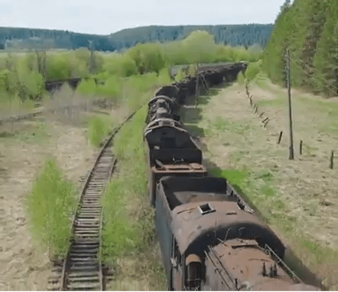 Almost reclaimed by nature, Russia's abandoned railway base haunts the landscape