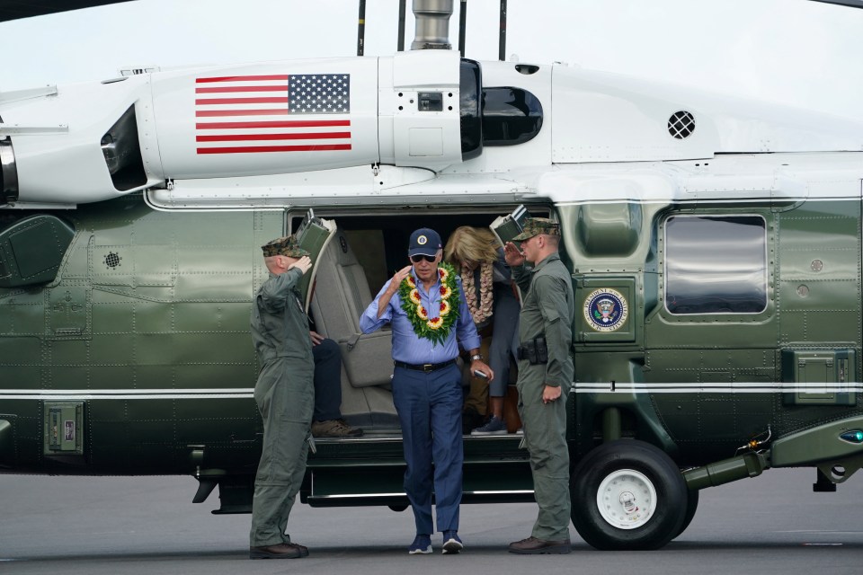 The US President steps down from Marine One in Maui