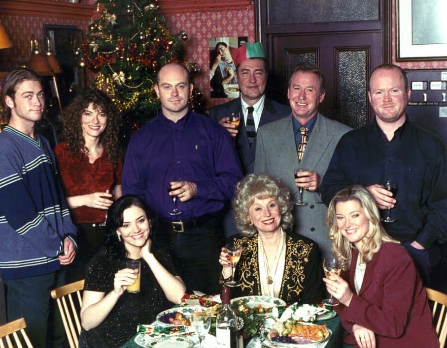 Former EastEnders cast members on the Queen Vic set for a Christmas special: (back row l-r) Joe Wicks (Paul Nicholls), Lorraine Wicks (Jacqueline Leonard), Grant Mitchell (Ross Kemp), Ted Hills (Brian Croucher), George Palmer (Paul Moriaty), Phil Mitchell (Steve McFadden), (seated l-r) Tiffany Mitchell (Martine McCutcheon), Peggy Mitchell (Barbara Windsor) and Kathy Mitchell (Gillian Taylforth).