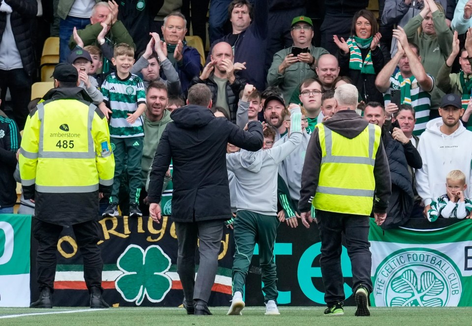 Celtic supporters applauded as Rodgers steered the boy off the pitch