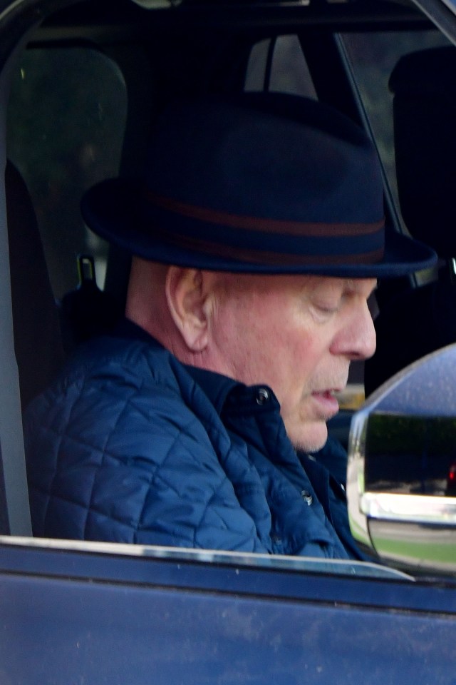 The Die Hard actor, 68, wrapped up in a blue padded jacket and hat as he enjoyed a drive around Los Angeles