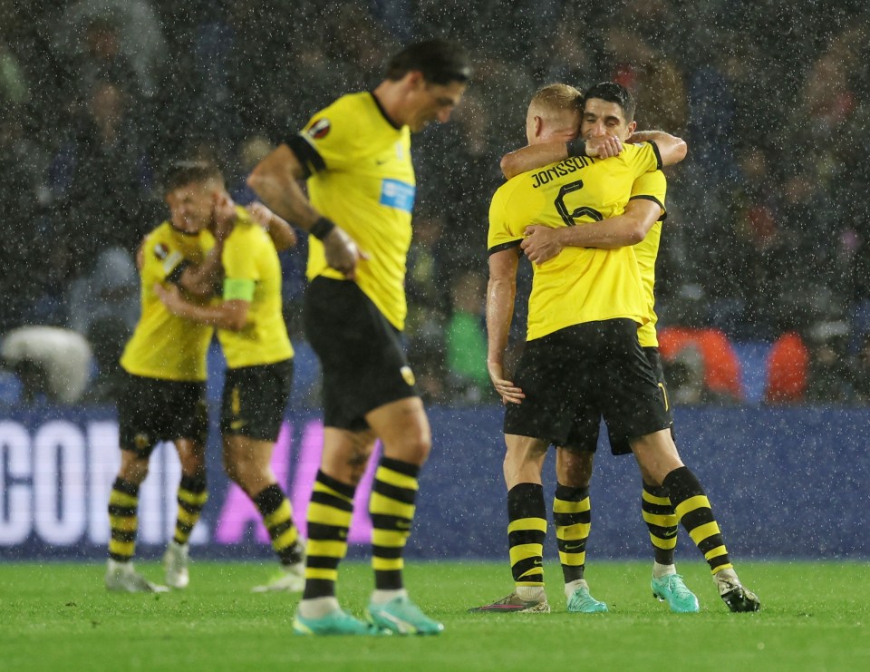 AEK Athens stars Jens Jonsson and Petros Mantalos celebrate victory