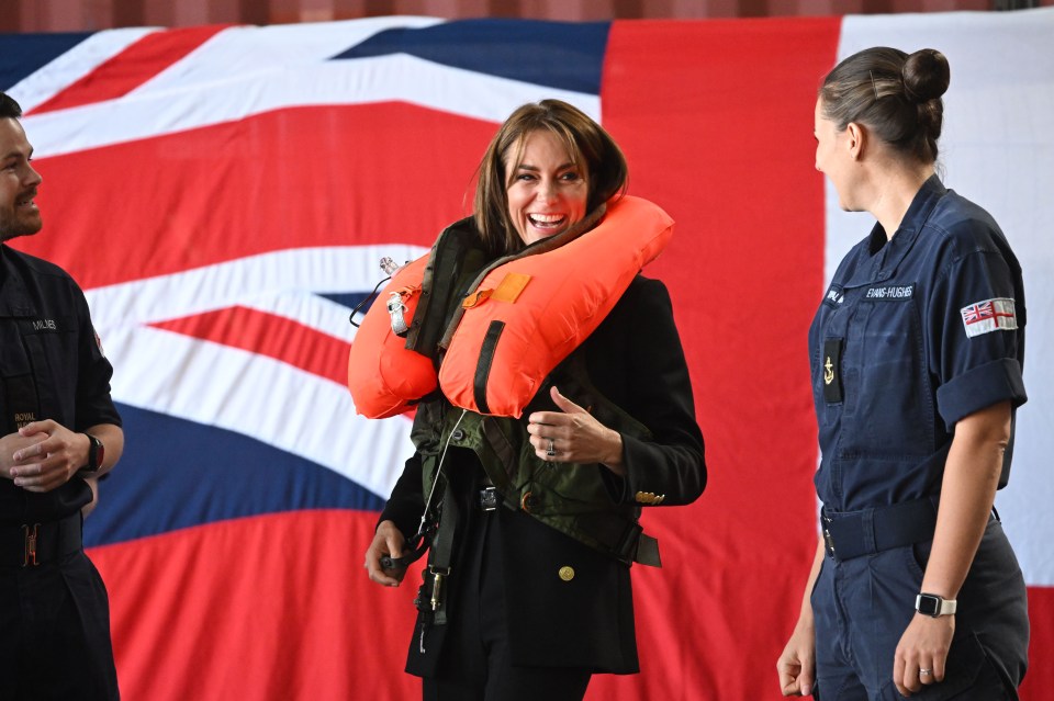 And she was all smiles after successfully blowing up the vest at Royal Naval Air Station Yeovilton