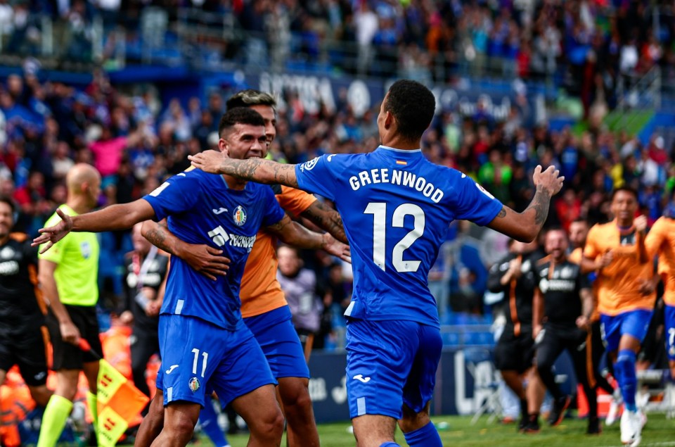 Greenwood celebrates with his new teammates after having a hand in the winner