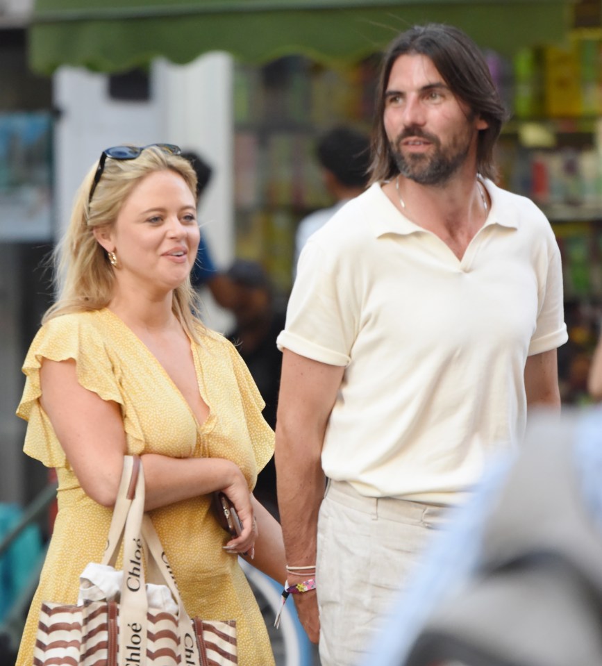 Emily Atack bags her own Oppenheimer as she walks hand in hand with NUCLEAR SCIENTIST Dr Alistair Garner in Chinatown after a cosy drinks date. The TV presenter was sat outside Cafe Boheme in Soho as she knocked back a cocktail while Alastair had a beer. ..Alistair describes himself on his Linkedin as a Materials scientist and electron microscopist specialising in nuclear and aerospace applications..*STRICTLY NO SUBSCRIPTIONS AND NO SOCIAL SOCIAL MEDIA USE*