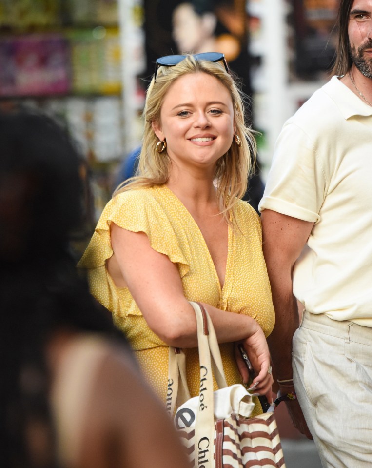 The star grinned and wore a yellow dress on her day out with the nuclear scientist