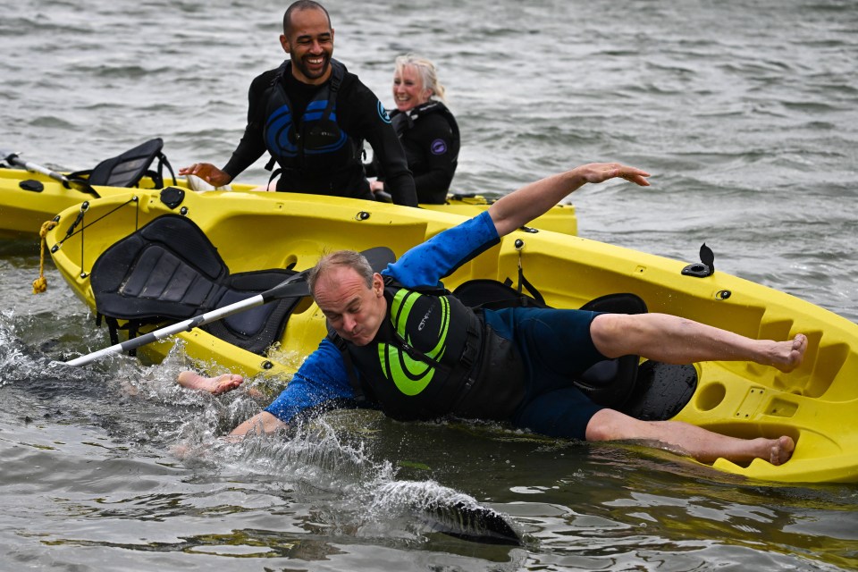 Sir Ed Davey is tipped into the water at Lib Dem conference