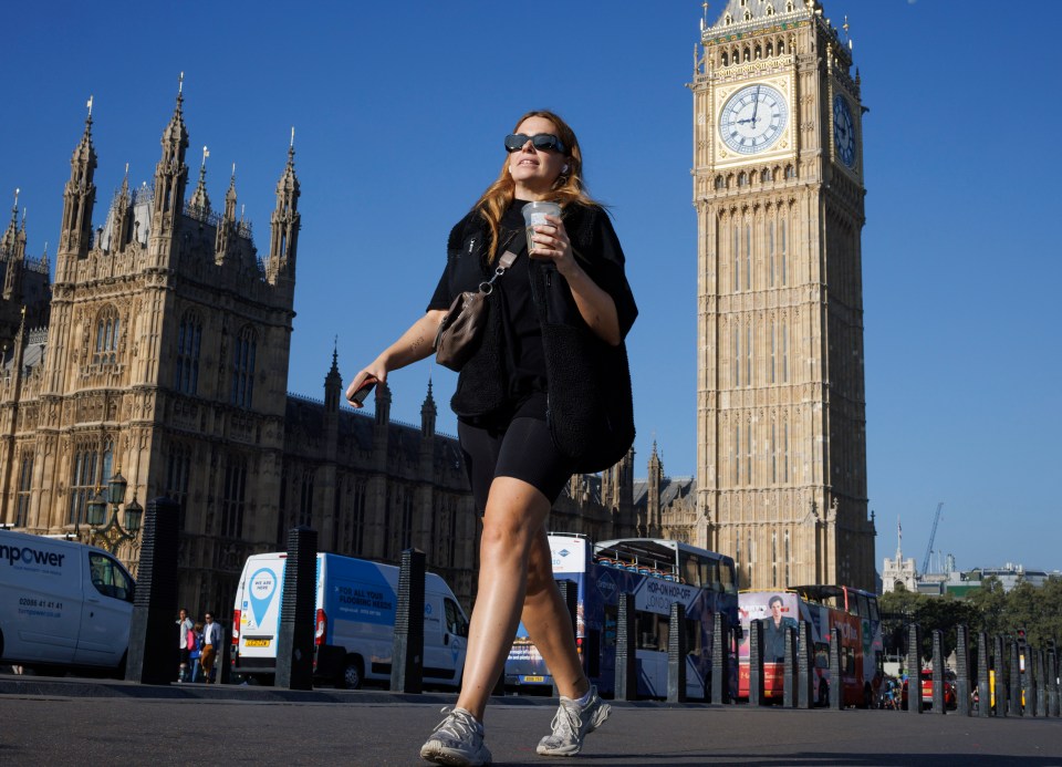 Â¿ Licensed to London News Pictures. 03/09/2023. London, UK. A women makes her way across Westminster Bridge in the early morning sunshine, as temperatures in the capital are expected to reach 30 degrees later this week.. Photo credit: Ben Cawthra/LNP