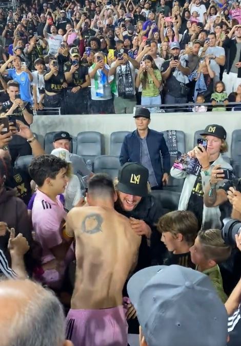 Lionel Messi hugs Owen Wilson after the full-time whistle