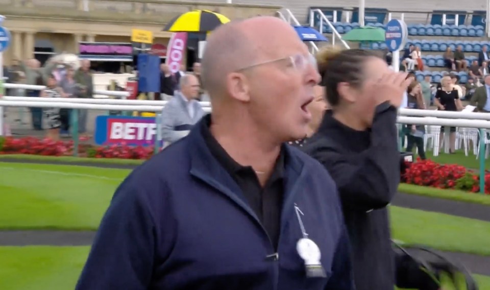 Mike Dean was getting excited as his horse looked as though it was going to win