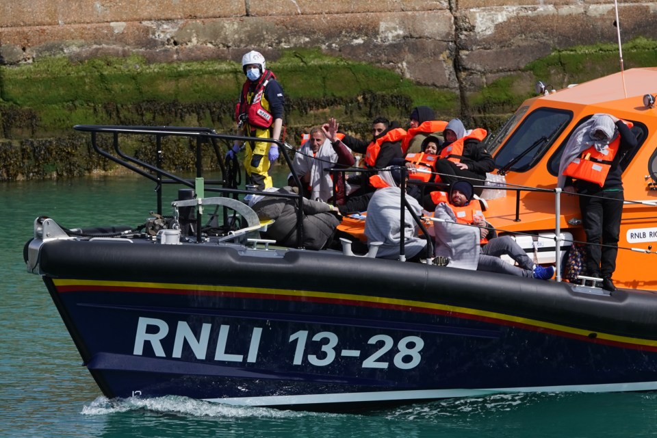 EMBARGOED TO 0001 TUESDAY SEPTEMBER 12 File photo dated 14/04/2022 of a group of people thought to be migrants are brought in to Dover, Kent, by the RNLI, following a small boat incident in the Channel. Dissatisfaction among the British public at the Government's handling of immigration is at its highest level since before the Brexit vote, according to research. Two-thirds (66%) of those questioned across England, Scotland and Wales said they are dissatisfied with the way politicians in charge are dealing with the issue, the Immigration Attitudes Tracker survey suggested. Issue date: Tuesday September 12, 2023. PA Photo. See PA story POLITICS Immigration. Photo credit should read: Gareth Fuller/PA Wire