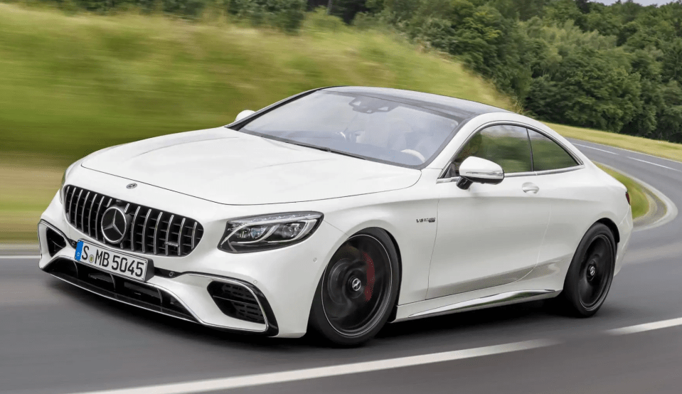 a white mercedes with the license plate s mb 5045