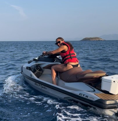 Alex Scott has been riding a jet ski on holiday