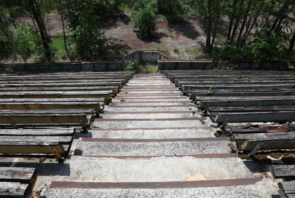 A steep stand of benches lead down to where the pitch used to be