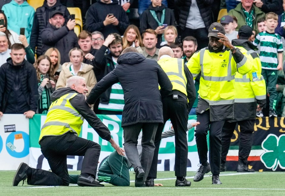 Brendan Rodgers was seen fending a steward off the fan at Livingston