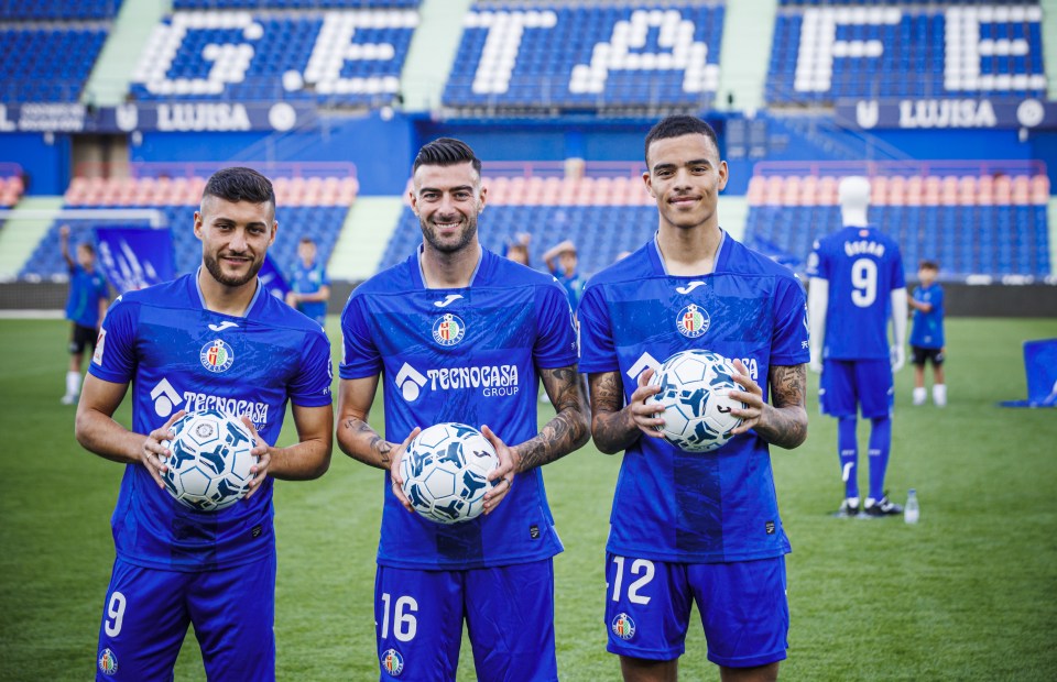 Mason Greenwood (right) being presented alongside Diego Rico and Oscar Rodriguez