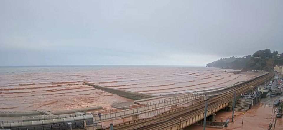 The seaside resort town was covered in brown murky water has rain lashed down