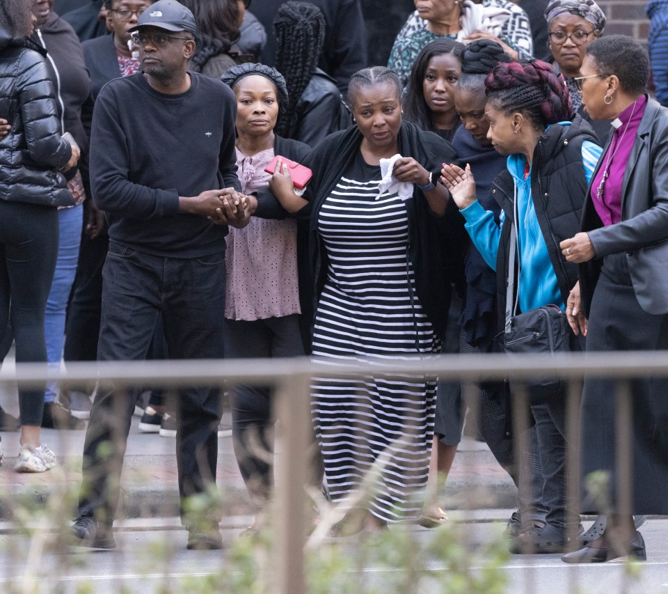 She was supported by the bishop of Croydon (far right)