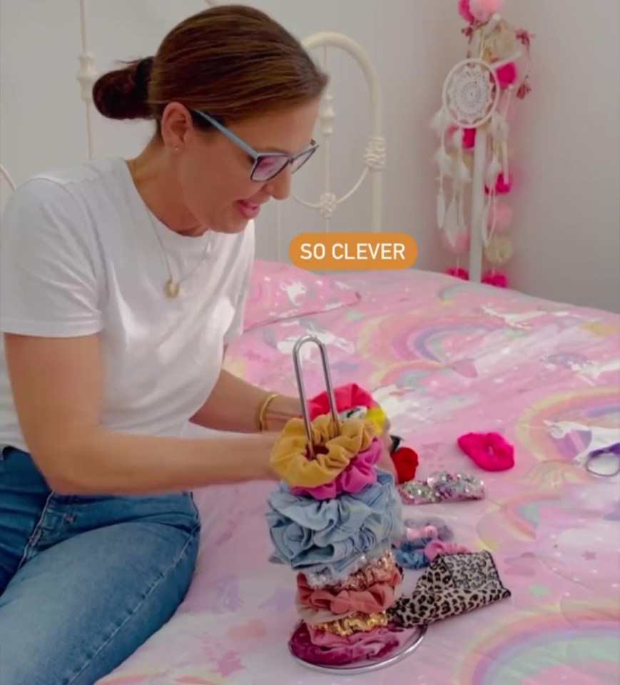 She began stacking the scrunchies on the kitchen roll holder