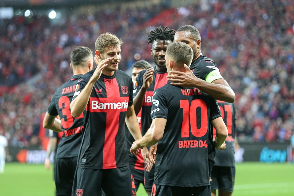 Here's Florian Wirtz being mobbed for his Leverkusen opener